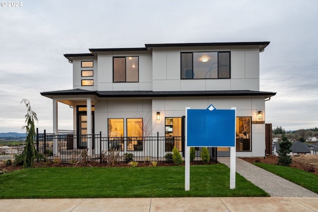 modern home featuring a front yard