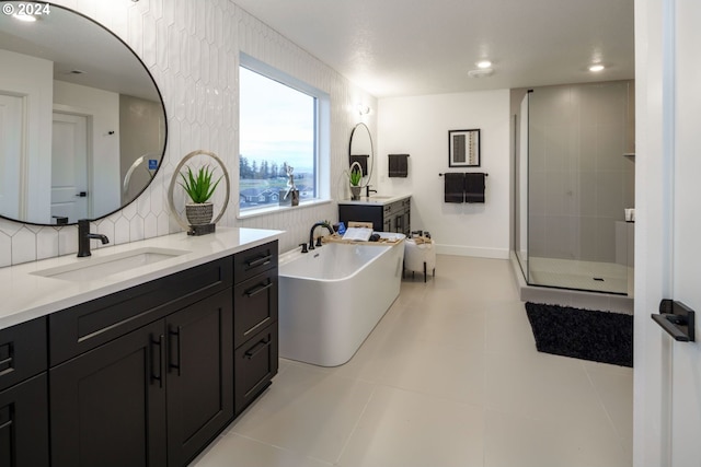 bathroom with independent shower and bath, vanity, backsplash, and tile patterned floors