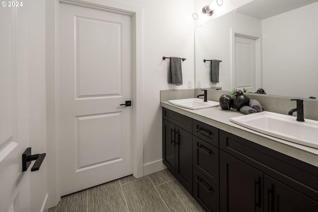 bathroom with tile patterned flooring and vanity