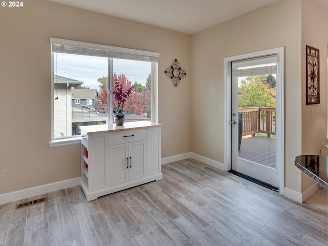 doorway with light hardwood / wood-style flooring