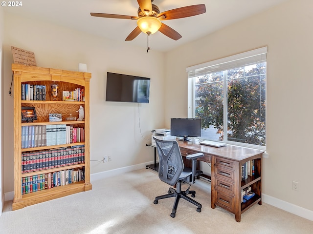 office space with light colored carpet and ceiling fan