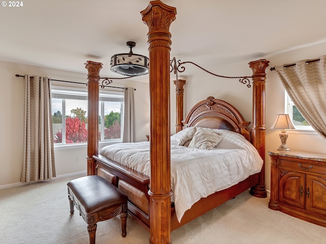 bedroom featuring light carpet