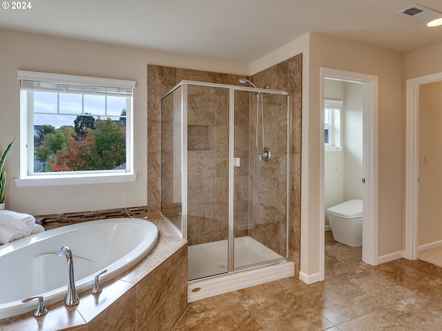 bathroom with shower with separate bathtub, toilet, and tile patterned floors