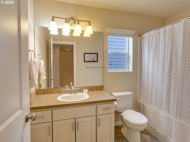 full bathroom featuring shower / bath combo, tile patterned floors, vanity, and toilet