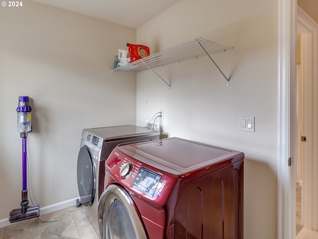 clothes washing area with washer and dryer