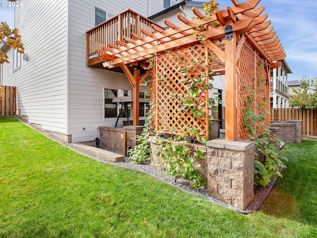 back of house with a yard, a pergola, and a balcony