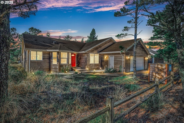 single story home featuring a garage