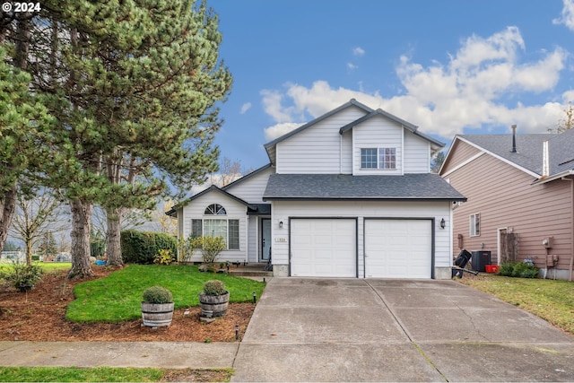 view of front of home featuring central AC unit, a garage, and a front lawn