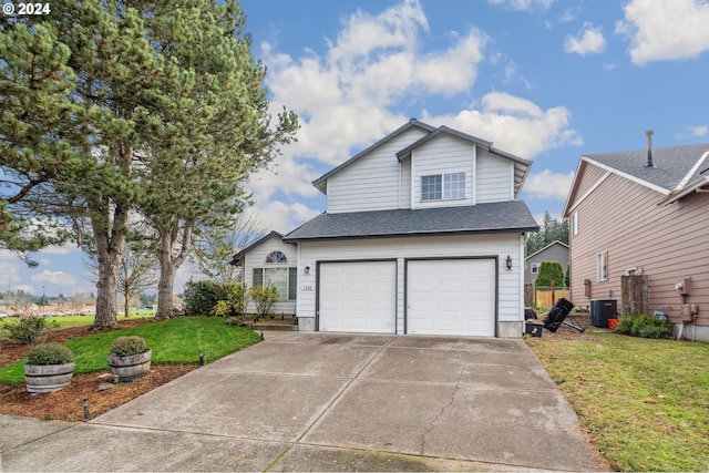 view of front property with a front lawn, central AC unit, and a garage