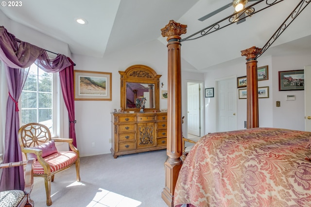 bedroom featuring lofted ceiling, ceiling fan, light carpet, and ornate columns