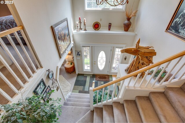 foyer with carpet floors