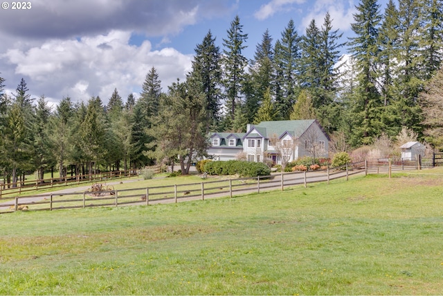 view of yard with a rural view