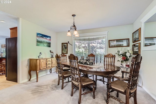 view of carpeted dining area