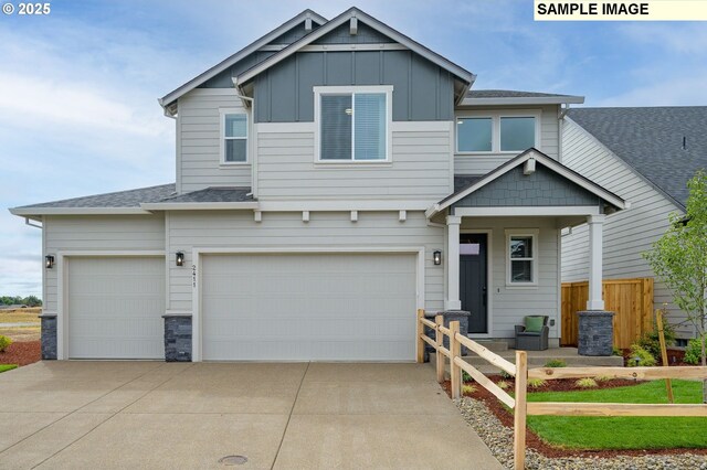 craftsman-style house with a garage and a front lawn