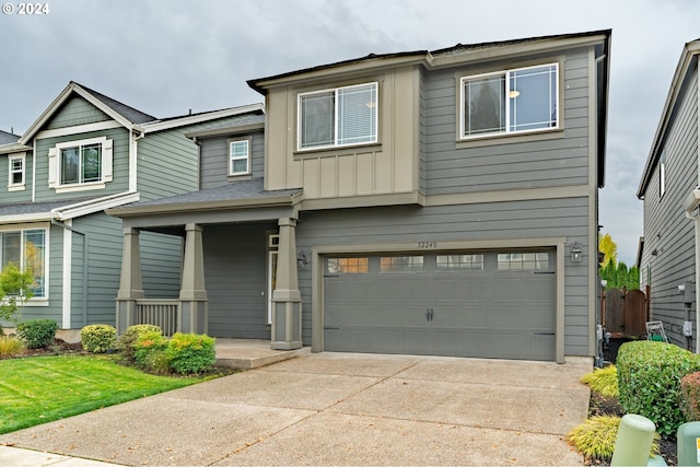 view of front of property with covered porch, driveway, board and batten siding, and a garage