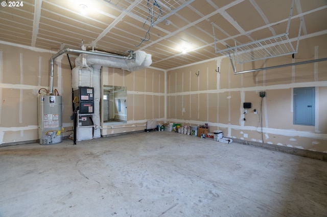 garage featuring electric panel and water heater