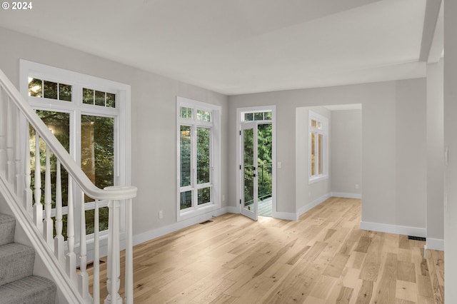 unfurnished room featuring light wood-type flooring