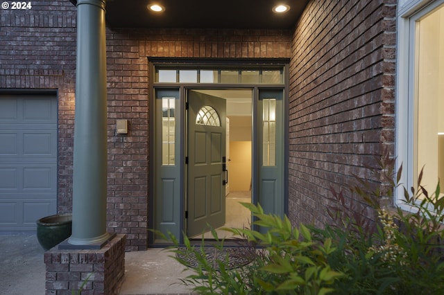 doorway to property featuring a garage