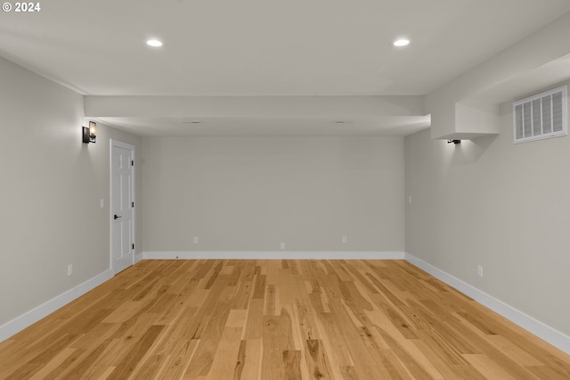 spare room featuring light hardwood / wood-style flooring