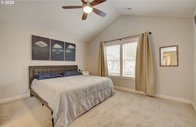 bedroom with light colored carpet, vaulted ceiling, and ceiling fan