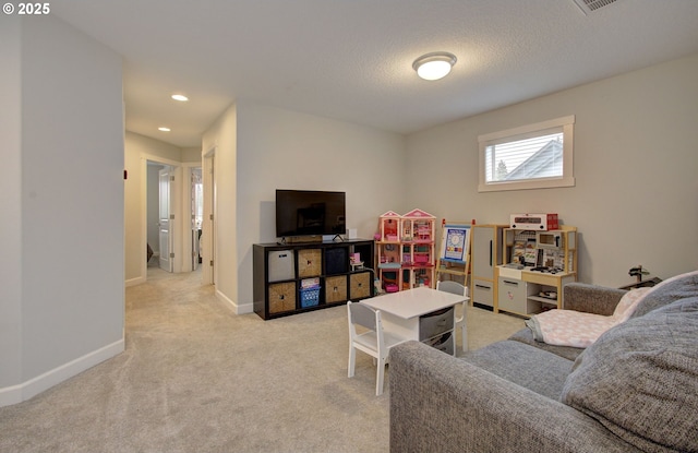 living room featuring a textured ceiling and light colored carpet