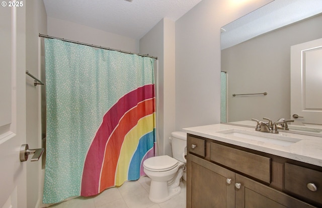 full bathroom featuring tile patterned floors, shower / bath combination with curtain, a textured ceiling, toilet, and vanity