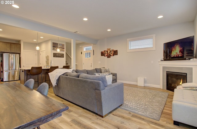 living room with light hardwood / wood-style floors