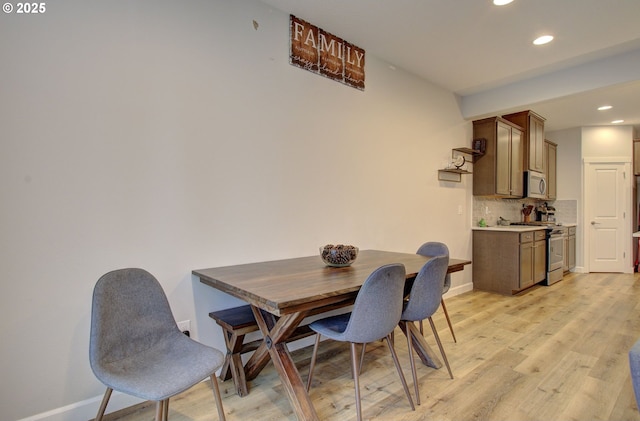 dining area with light hardwood / wood-style flooring