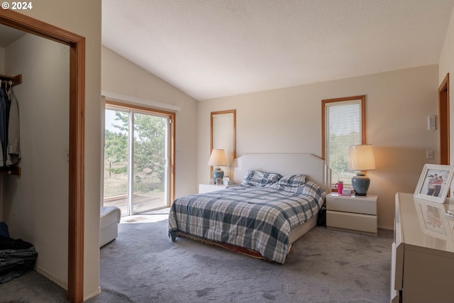 bedroom featuring light carpet, access to outside, and vaulted ceiling