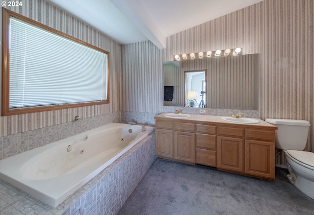 bathroom with vanity, lofted ceiling, tiled bath, and toilet