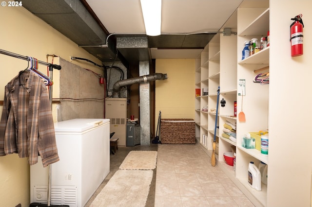 basement featuring refrigerator