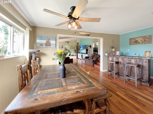 dining space featuring hardwood / wood-style flooring and ceiling fan