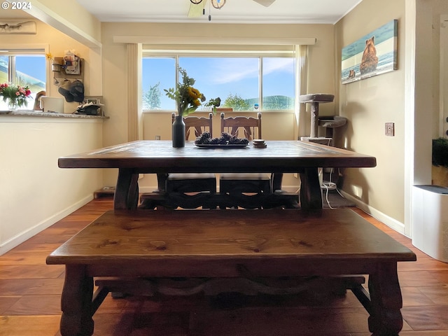 dining space featuring wood-type flooring