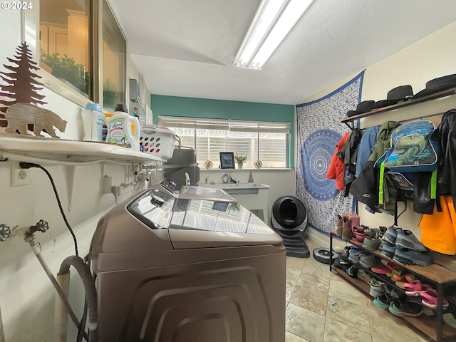 clothes washing area featuring separate washer and dryer