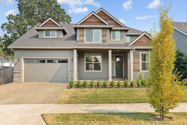 craftsman-style house featuring a porch and a front lawn