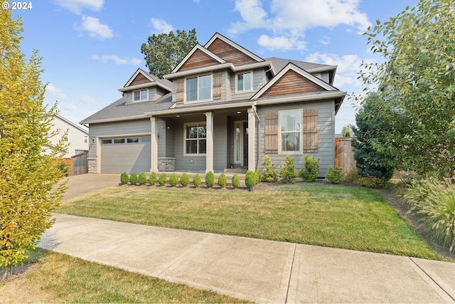 craftsman-style home featuring a porch and a front lawn