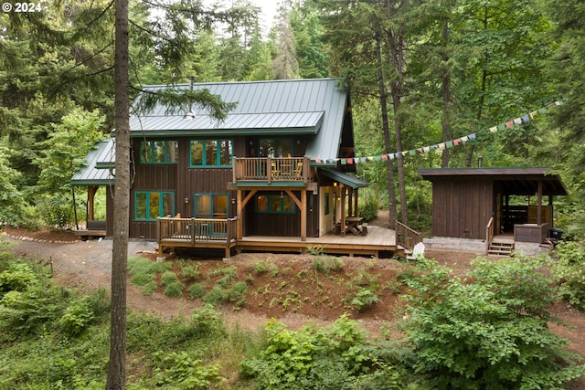 back of house featuring a deck