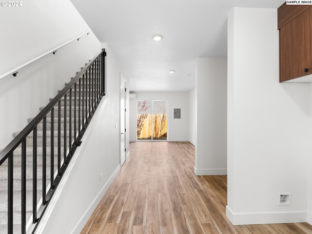 hall with light hardwood / wood-style flooring