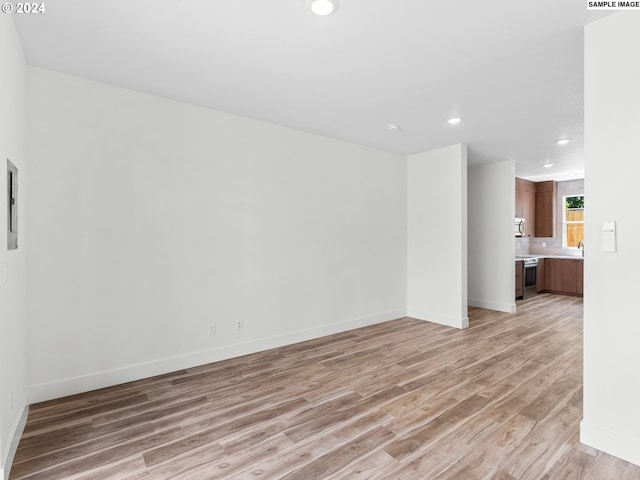 empty room with light hardwood / wood-style floors