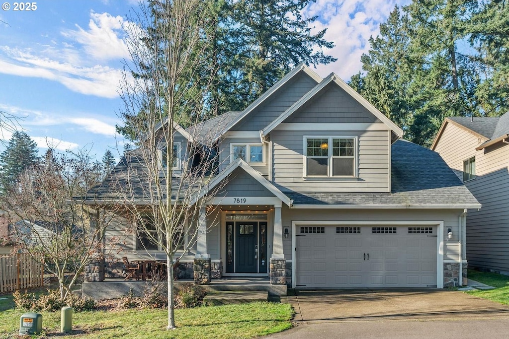 craftsman inspired home with a garage