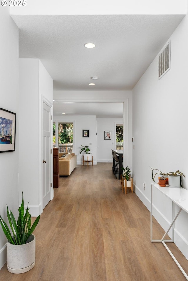 hall featuring light hardwood / wood-style flooring