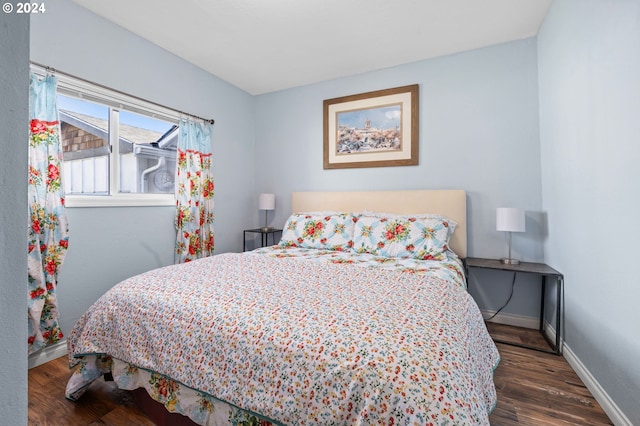 bedroom featuring dark hardwood / wood-style floors