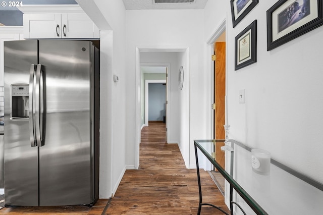 kitchen with white cabinetry, stainless steel refrigerator with ice dispenser, and dark hardwood / wood-style floors