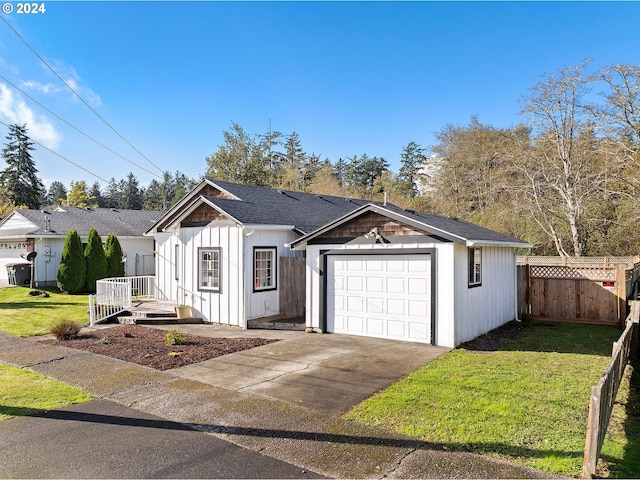 view of front facade featuring a front lawn and a garage