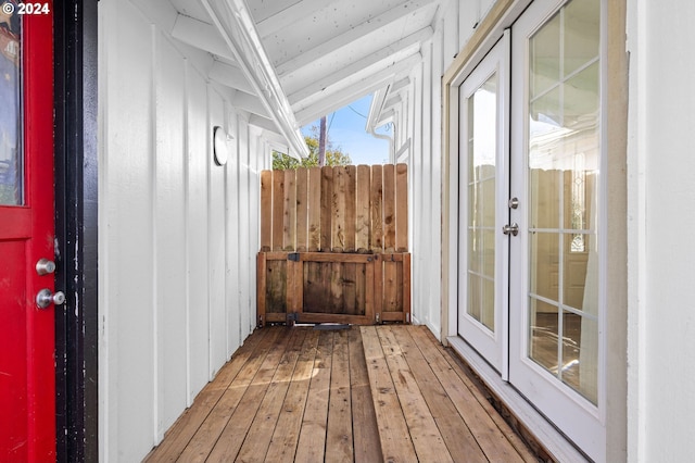 interior space featuring lofted ceiling, french doors, and hardwood / wood-style flooring