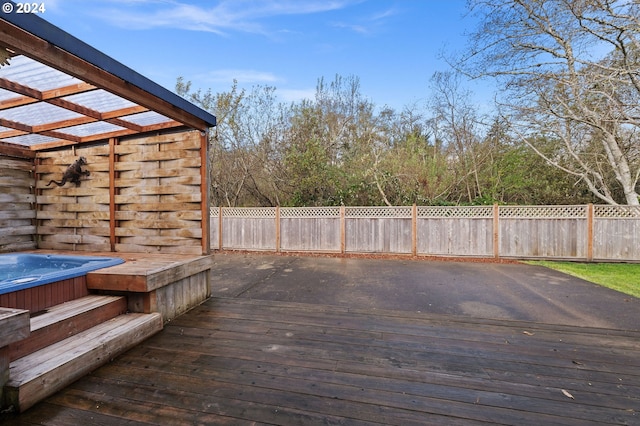 deck featuring a hot tub