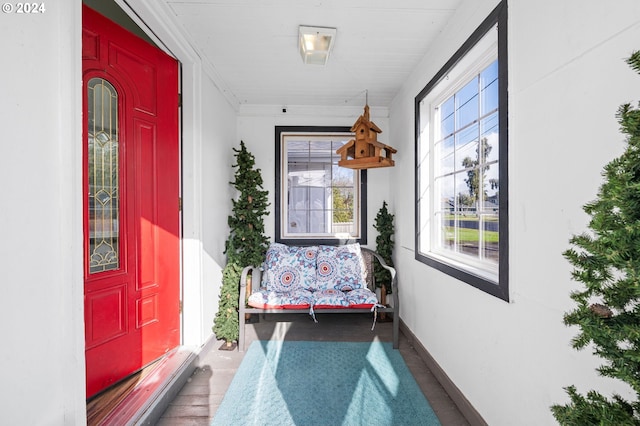 entrance to property featuring covered porch