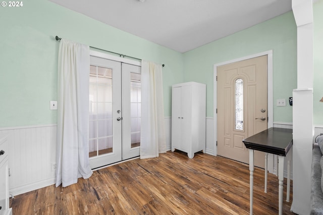 entrance foyer with french doors and wood-type flooring