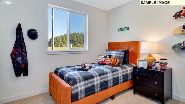 bedroom with light carpet and baseboards