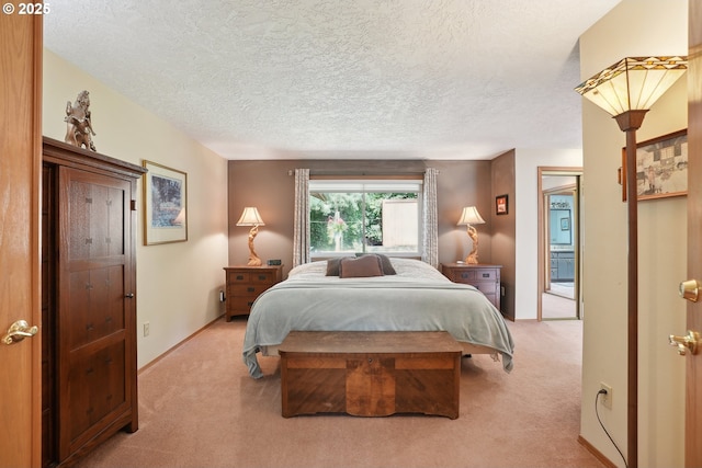 bedroom featuring light carpet, a textured ceiling, and baseboards